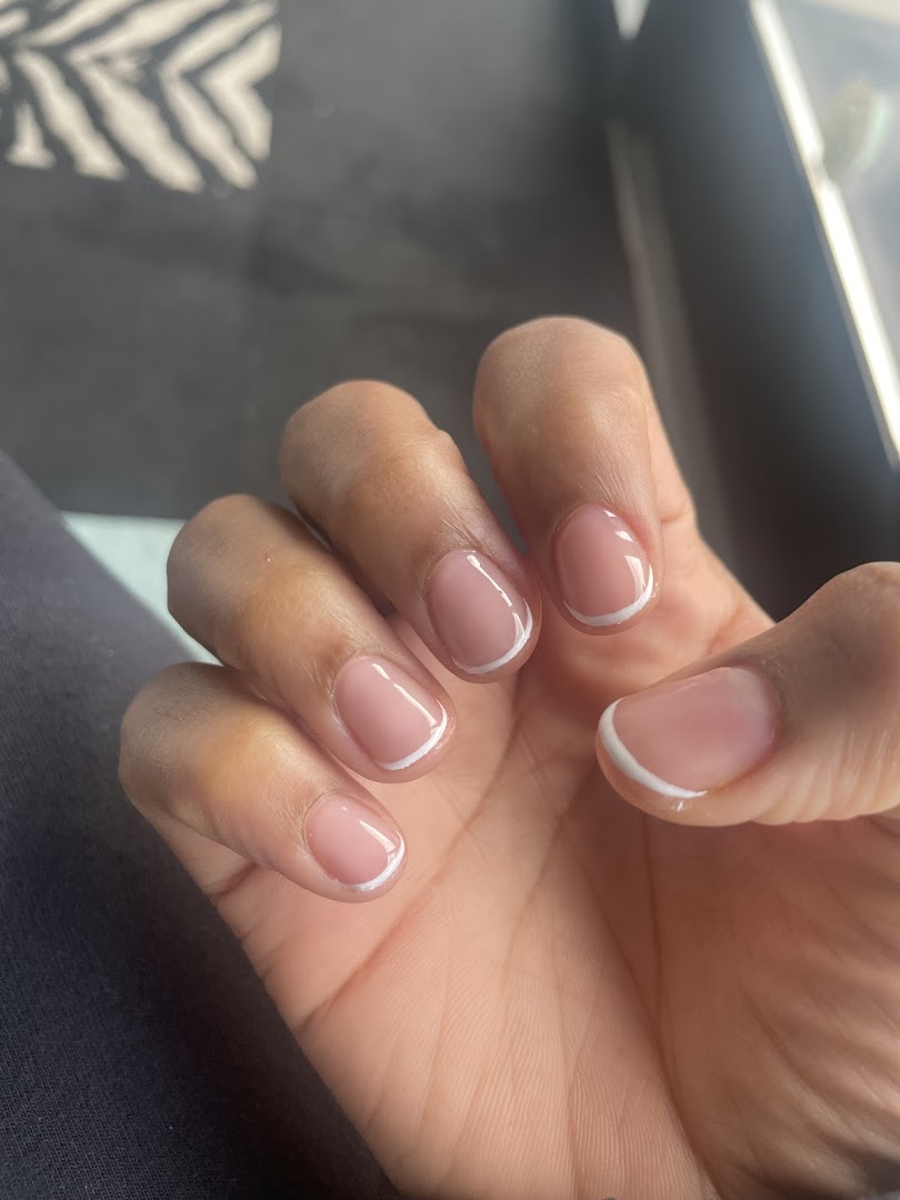 Classic white French tip manicure on short square nails